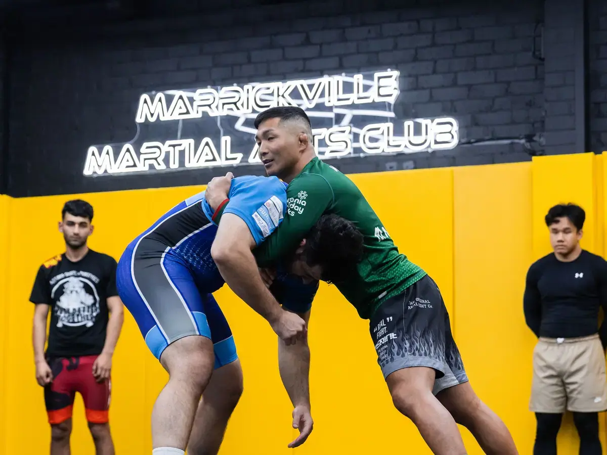 A grappling class on one of the mat areas at MMAC